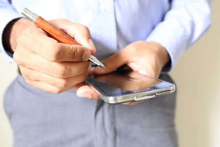 Close up of a man using mobile smart phone. Cellphoneの写真素材