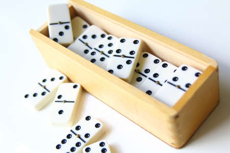 dominoes and wood box isolated on white background