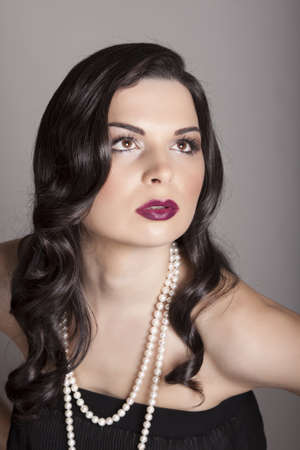 beauty portrait young woman with black long shiny hairの写真素材