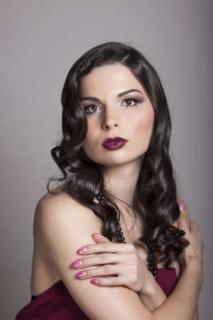 beauty portrait young woman with black long shiny hairの写真素材