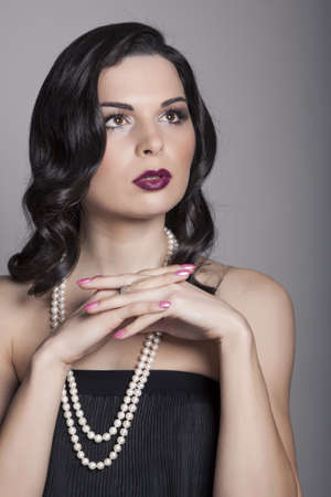 beauty portrait young woman with black long shiny hairの写真素材