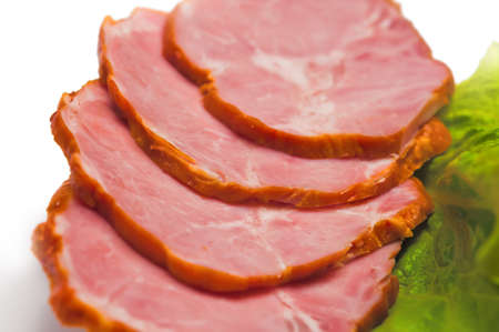 Delicious slices of ham and lettuceの写真素材