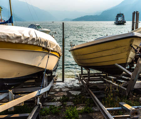 Boats on Como lake coast, Italyの写真素材