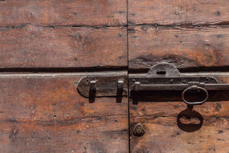 old bolt on a wooden doorの写真素材