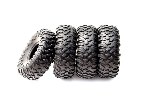 black rubber tire from toy car and plastic gray wrench key isolatedの写真素材