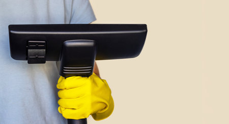 woman holding vacuum cleaner handle carpet floor brush isolated