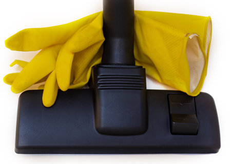 woman holding vacuum cleaner handle carpet floor brush isolatedの写真素材