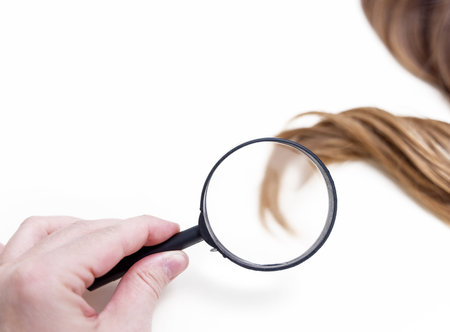 woman long curly hair strand threads isolated with cosmetic care productの写真素材