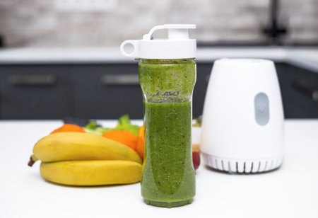 woman do healthy smoothie at kitchen, weight loss concept, measure tapeの写真素材