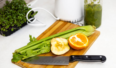 woman do healthy smoothie at kitchen, weight loss concept, measure tape