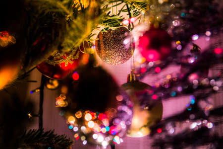 Beautiful Christmas ornament hidden inside the Christmas treeの写真素材