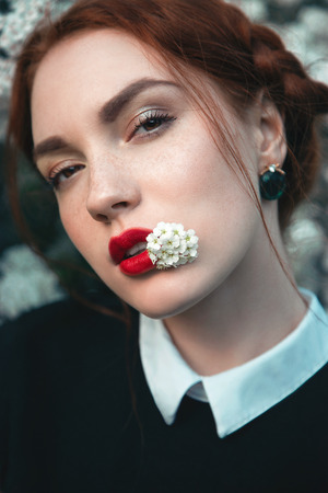 Pretty girl with curly redhairの写真素材