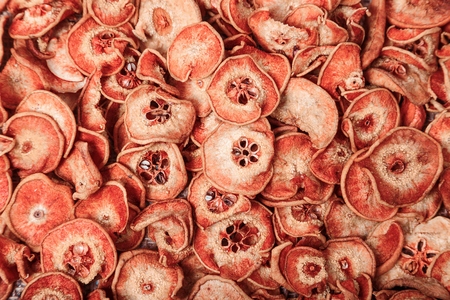 Dried fruits and berries on sacking background