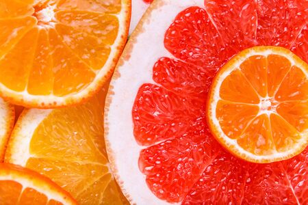 Fresh sliced citrus on white background close-up macro isolated