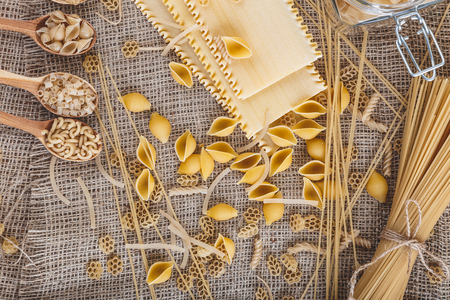 Mound pasta on sacking background close-up macroの写真素材