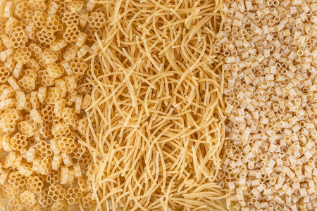 Mound of pasta on a white background close-up macro isolatedの写真素材