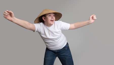 Teenage boy in a hat isolated on white backgroundの写真素材