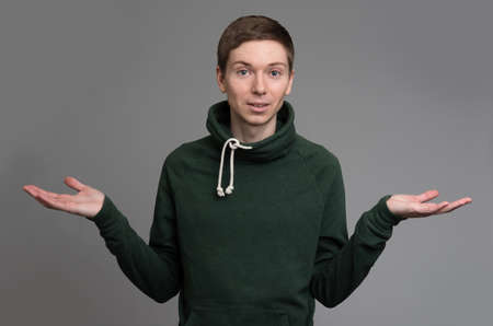 Isolated man is presenting a product or idea.の写真素材