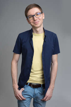 student in glasses isolated on a gray backgroundの写真素材