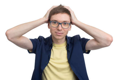 student holding his hands on his head isolated on white backgroundの写真素材
