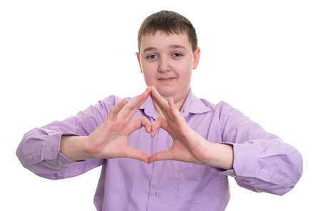 handsome young guy showing the heart sign with his handsisolatedの写真素材