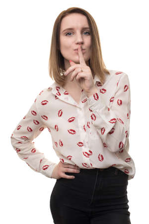 young girl shows gesture of silence isolatedの写真素材