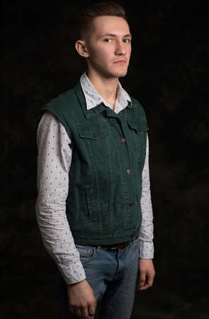 Isolated studio portrait of a handsome thoughtful young man