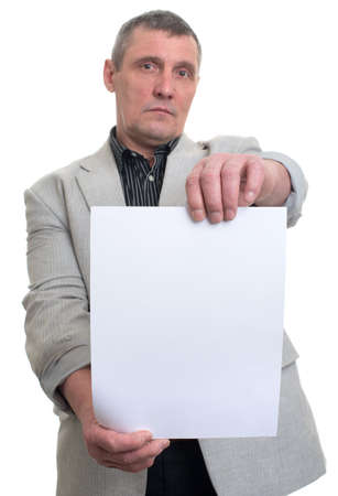 Businessman holding a white sheet in hands isolatedの写真素材