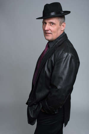 a man in a jacket isolated on a gray backgroundの写真素材