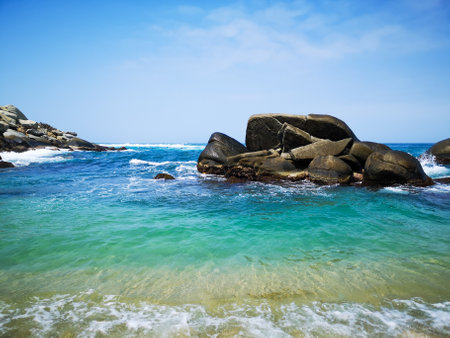 Rock formation in turquoise sea waterの写真素材