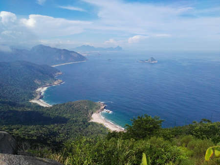View on the sea and green coastline - Pedra Do Telegrafo (telegraph rock), Rio de Janeiro, Brazilの写真素材