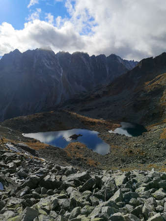 View on the Velke Zabie pleso Mengusovske mountain lake and Male Zabie pleso Mengusovske mountain lake in High Tatras during autumnの写真素材