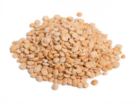 a handful of dried peas halves on a white backgroundの写真素材