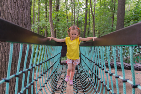 girl walking on the suspension bridgeの写真素材