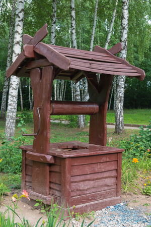 dirty wooden well in the parkの写真素材