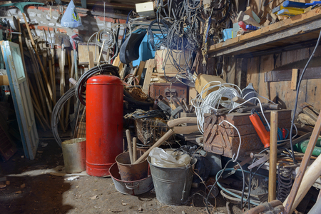 pile of tools and various items in the workshopの写真素材