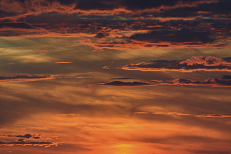 bright red sky with clouds at sunsetの写真素材