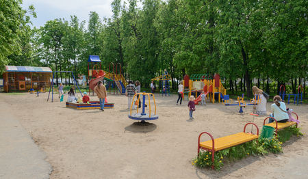 May 24, 2016: Children with parents in the children's playground in the park named after Nikolayeva. Cheboksary. Russia.のeditorial素材
