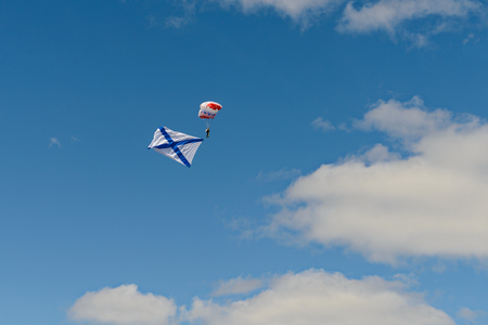 May 9, 2018: A parachutist with the St. Andrew's flag of the Russian Navy on the Day of Victory in the Great Patriotic War of 1941-1945. Cheboksary. Russia.のeditorial素材