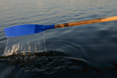 paddle boat with flowing water above the surface of the lake
