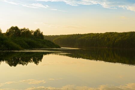 Summer evening landscape with lake and wooded shoresのeditorial素材