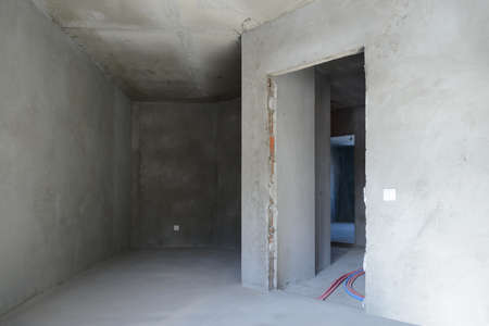 The interior of several rooms without finishing in a new buildingの写真素材