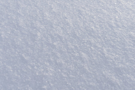 The surface of a snowdrift is light bluish in colorの写真素材