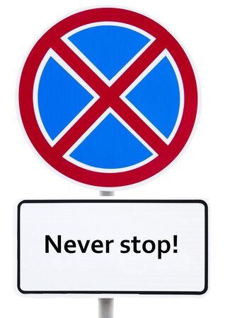 Road sign - "Never stop!" on whiteの写真素材