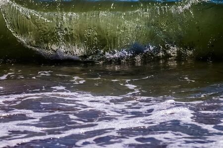Background oncoming approaching powerful sea wave.