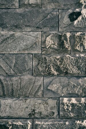 Background, texture of an old gray stone wall.