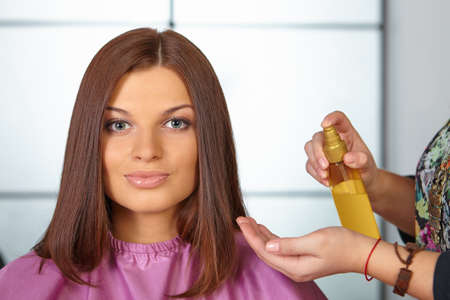 Hairdresser uses cosmetic oil 