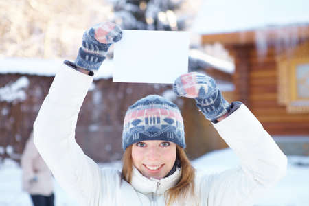 Young beautiful woman with blank banner  Winter の写真素材