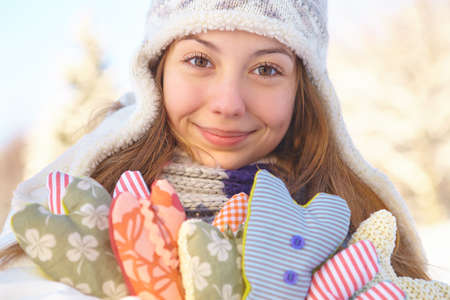 Winter. Girl with heart shapes outdoor.の写真素材