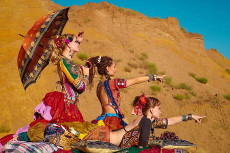 Tribal dancers. Women in ethnic costumes.の写真素材